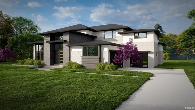 a front view of house with yard and green space