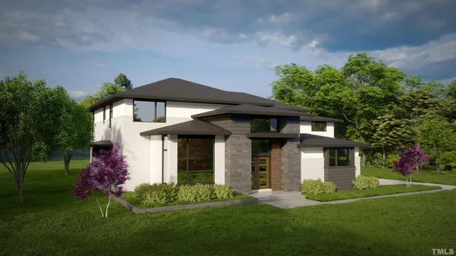 a front view of a house with a garden