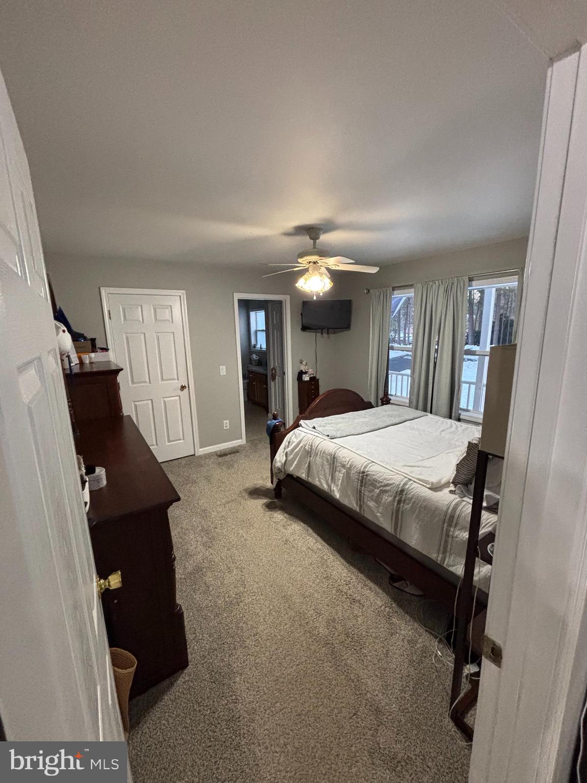 30009 West Mill Run Milton, DE 19968 - Photo 12 of 25 a bedroom with a bed and a large mirror