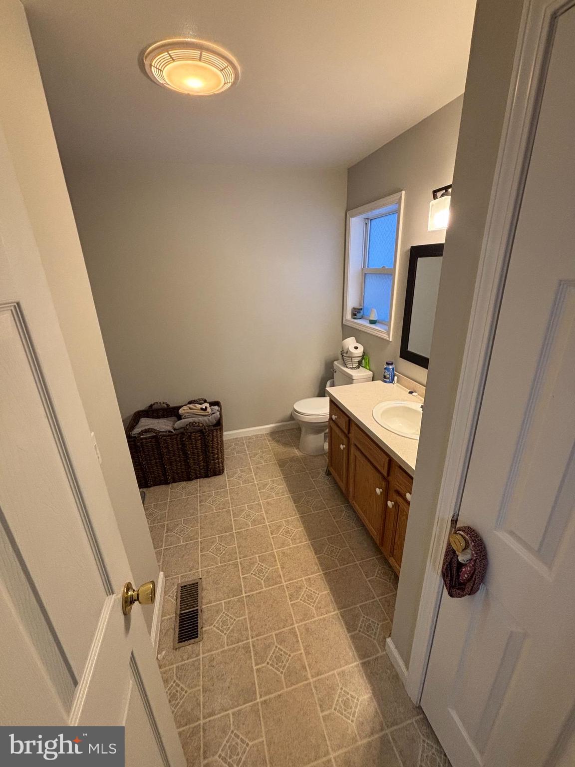 30009 West Mill Run Milton, DE 19968 - Photo 14 of 25 a bathroom with a sink and mirror