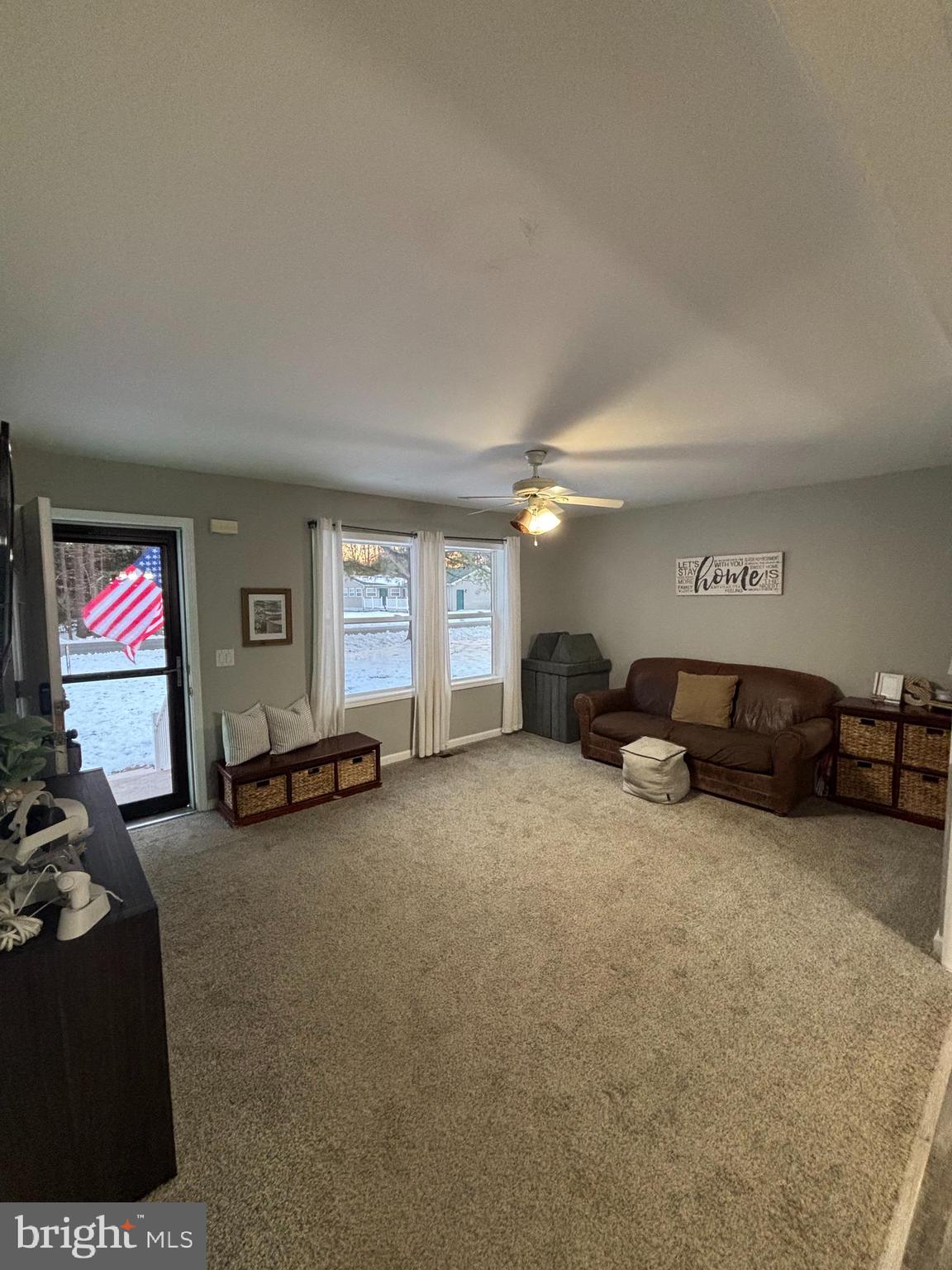 30009 West Mill Run Milton, DE 19968 - Photo 2 of 25 a living room with furniture and a flat screen tv