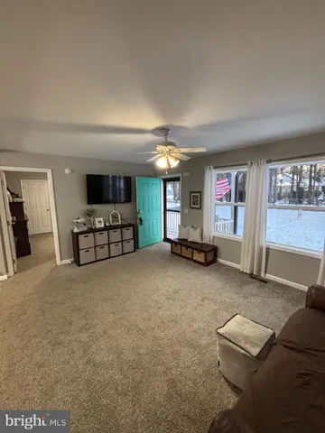 a view of livingroom with furniture and window