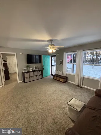 a view of livingroom with furniture and window