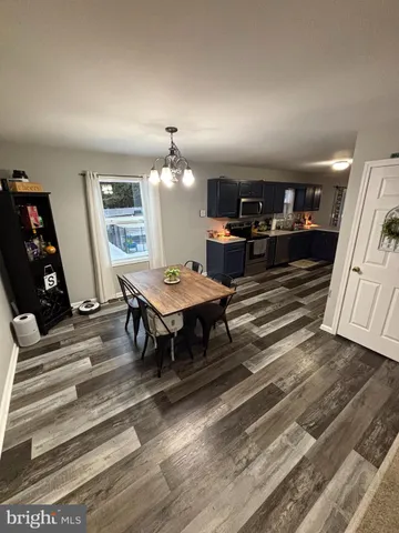 a living room with furniture and a piano