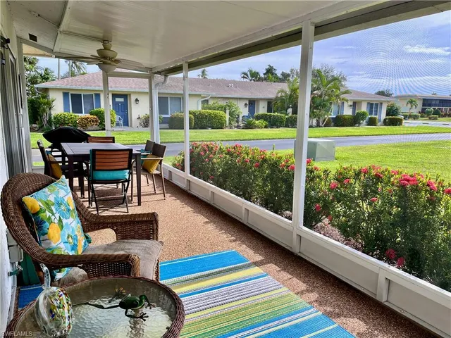 a balcony with furniture and a garden