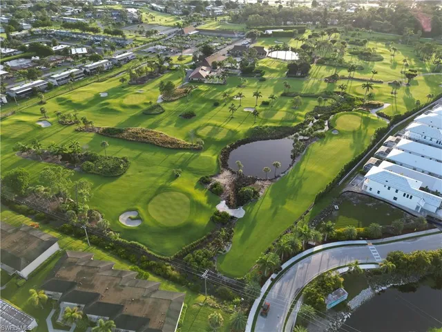 an aerial view of a residential houses with outdoor space
