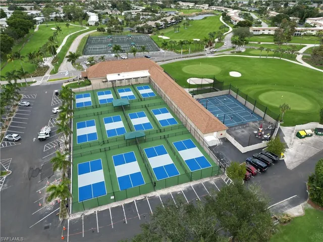 an aerial view of a pool yard patio and outdoor seating