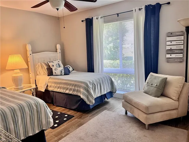 a bedroom with a bed and a couch