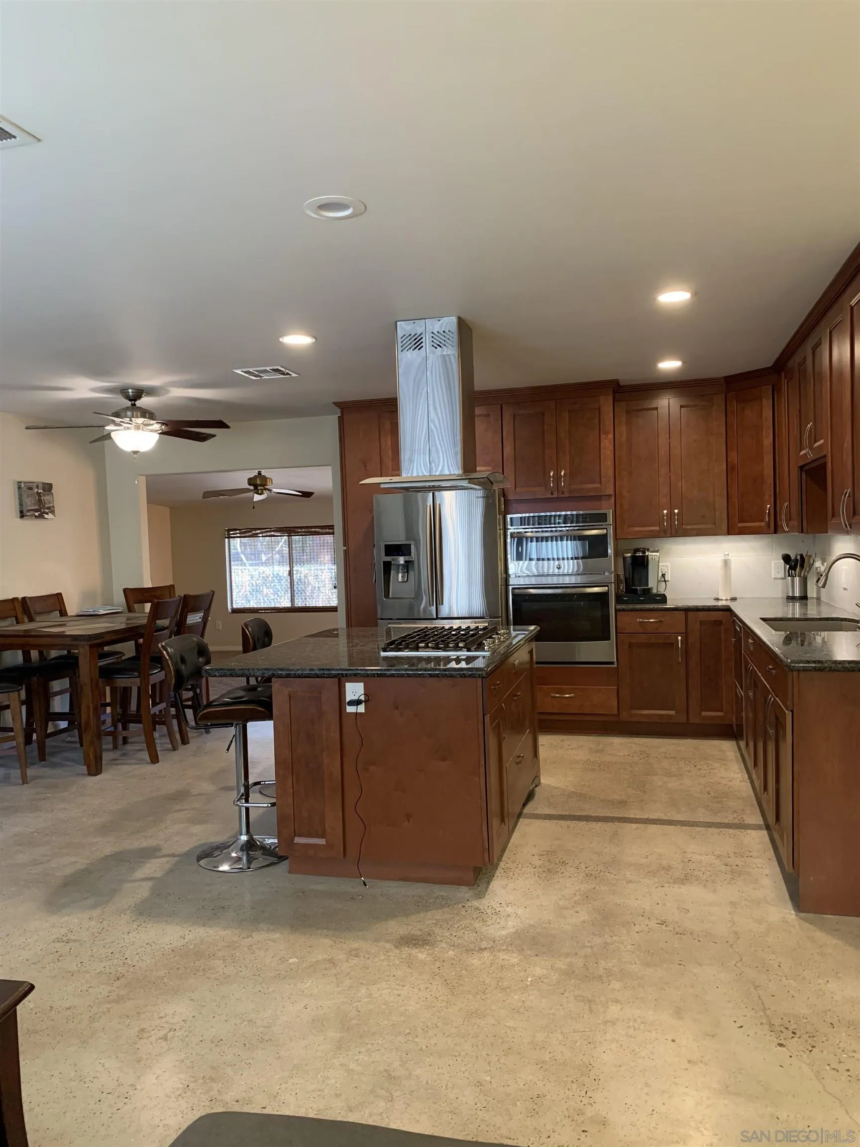 9935 Blossom Valley Road El Cajon, CA 92021 - Photo 21 of 36 a kitchen with lots of counter top space and appliances