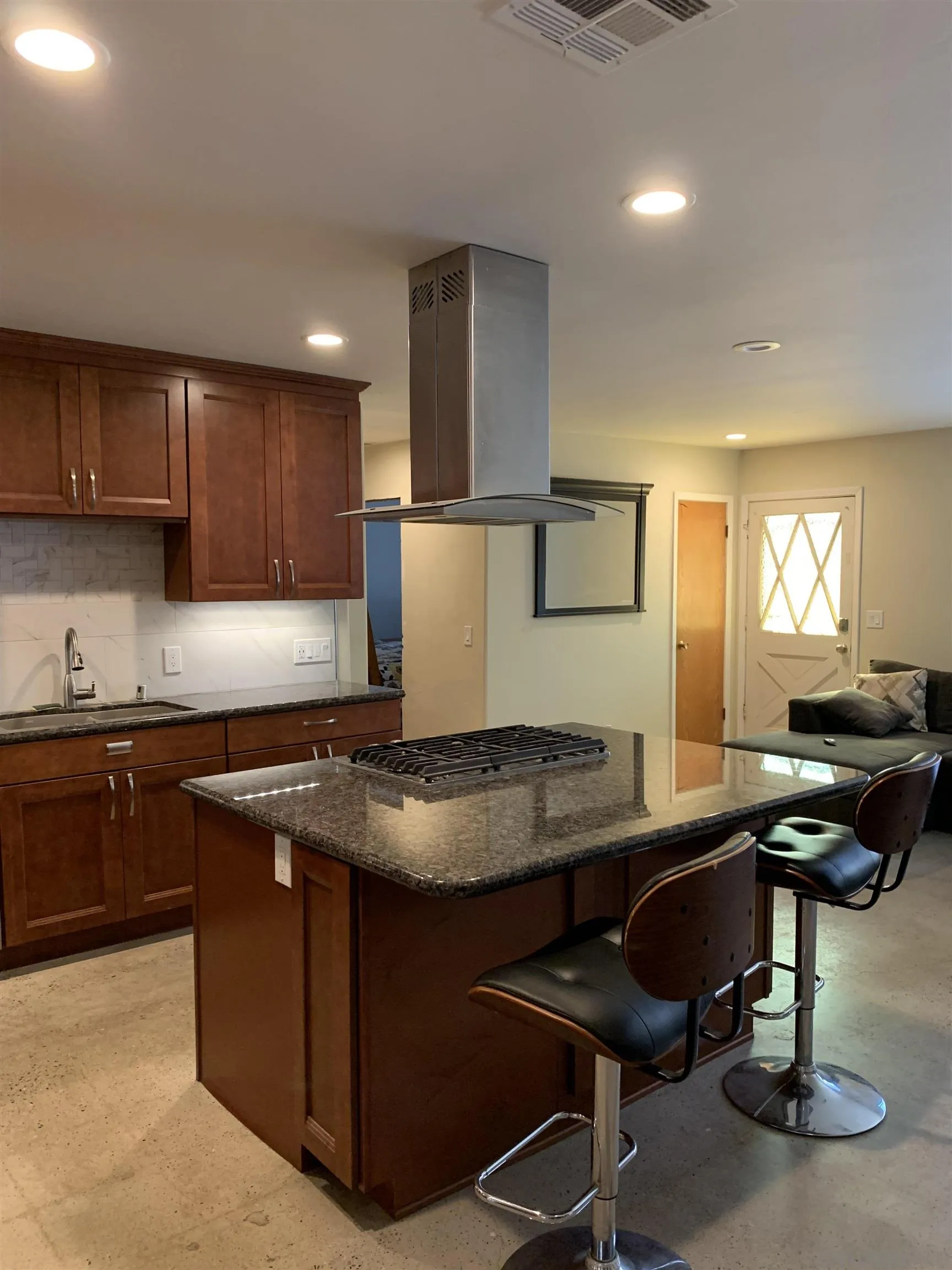 9935 Blossom Valley Road El Cajon, CA 92021 - Photo 22 of 36 a kitchen with a stove a sink a counter space and cabinets