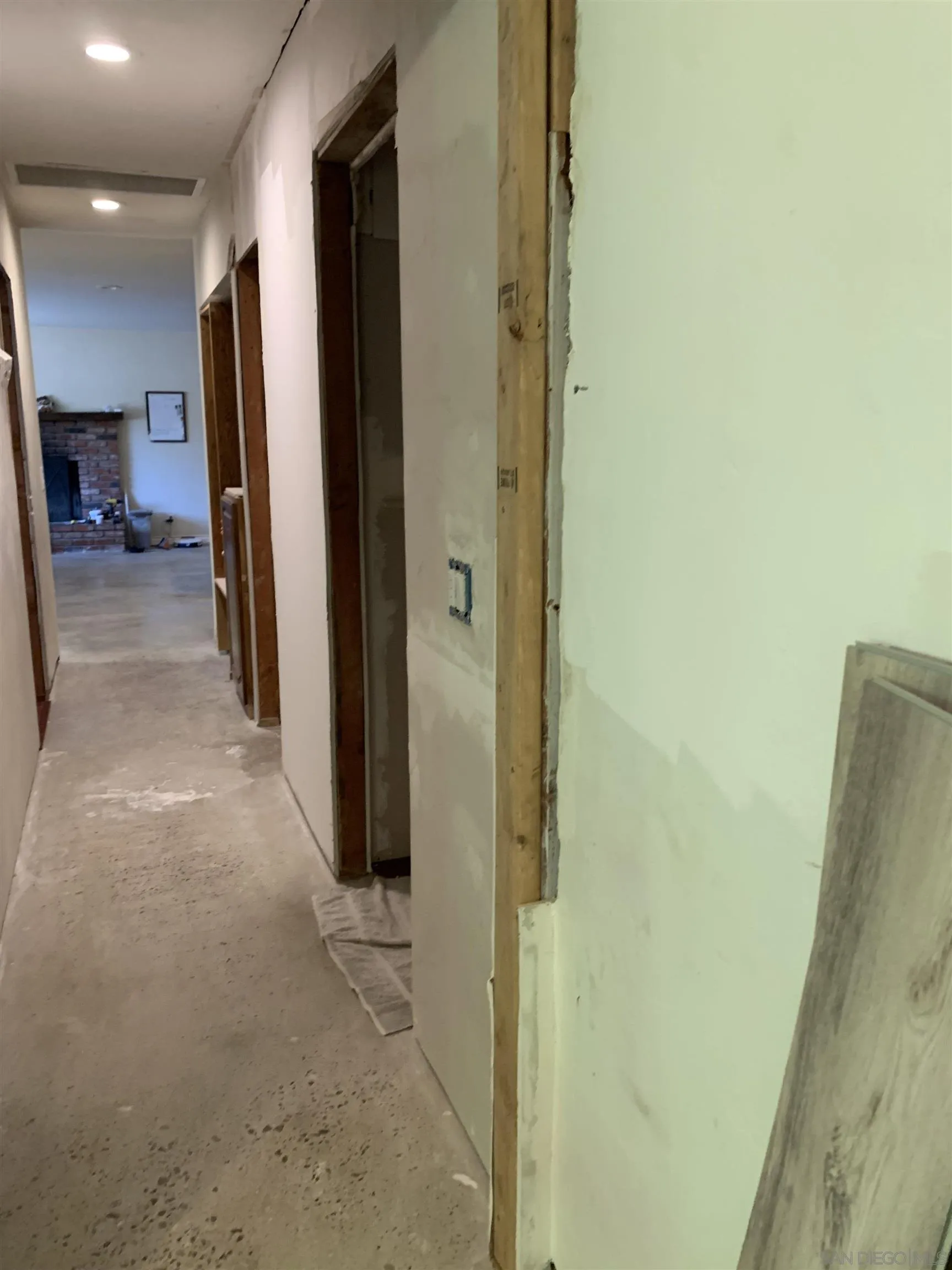 9935 Blossom Valley Road El Cajon, CA 92021 - Photo 33 of 36 a view of a hallway with wooden shelves