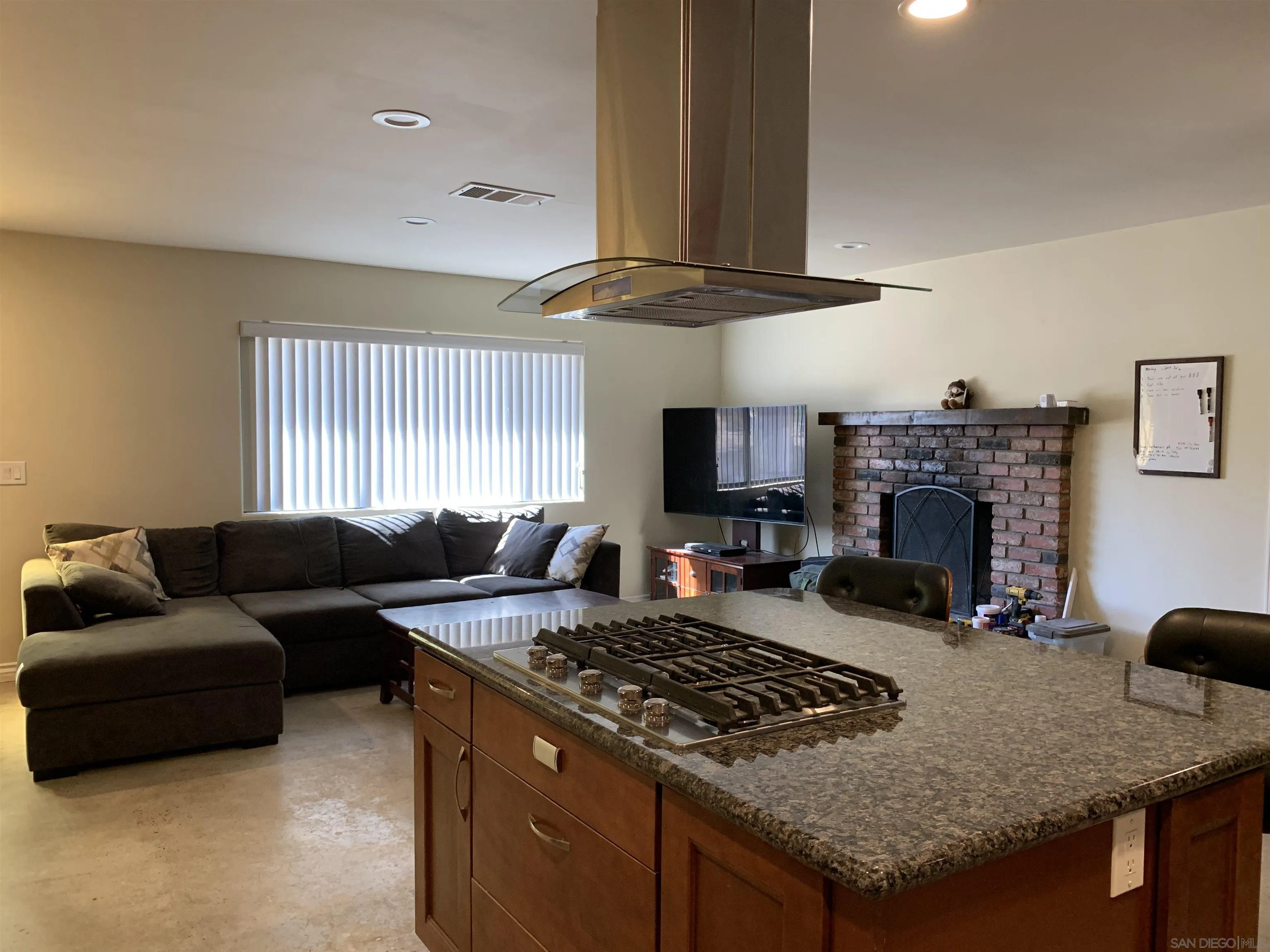9935 Blossom Valley Road El Cajon, CA 92021 - Photo 6 of 36 a living room with furniture and a fireplace