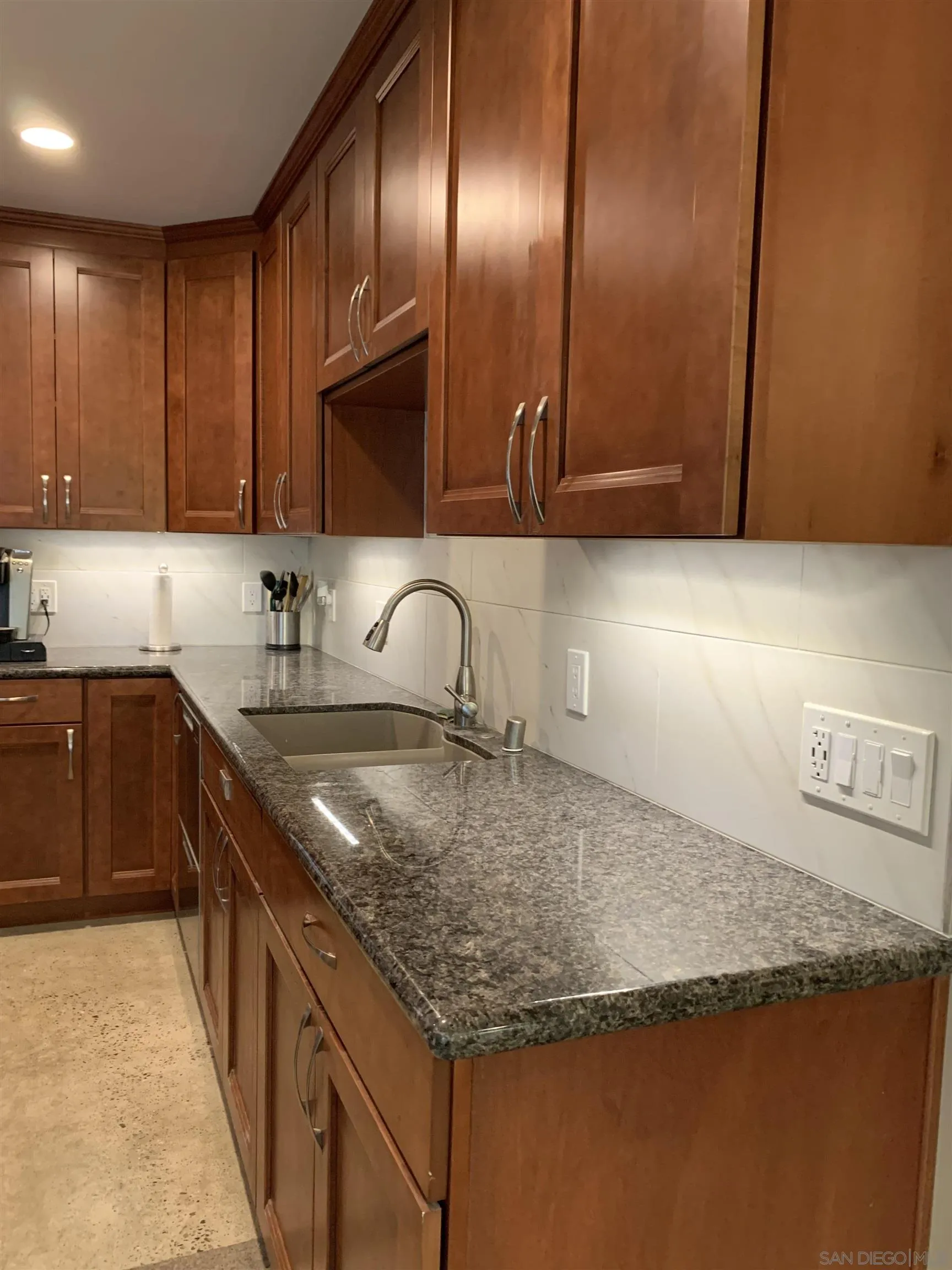 9935 Blossom Valley Road El Cajon, CA 92021 - Photo 8 of 36 a kitchen with granite countertop a sink a stove and a cabinets