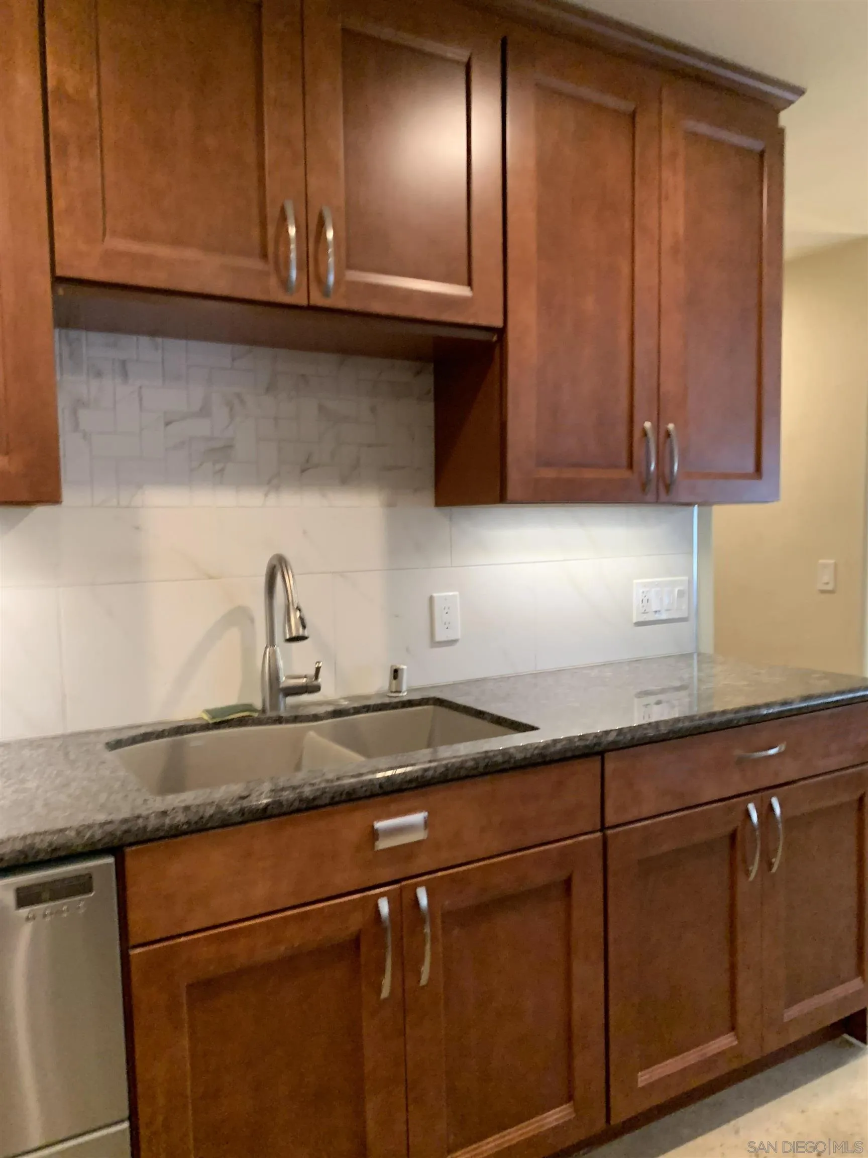 9935 Blossom Valley Road El Cajon, CA 92021 - Photo 9 of 36 a kitchen with granite countertop stainless steel appliances sink and cabinets