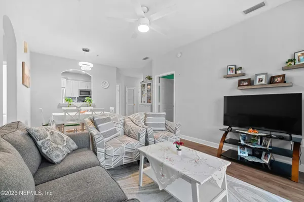 a living room with furniture and a flat screen tv