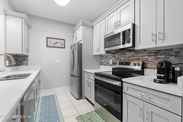 a kitchen with a stove and a microwave