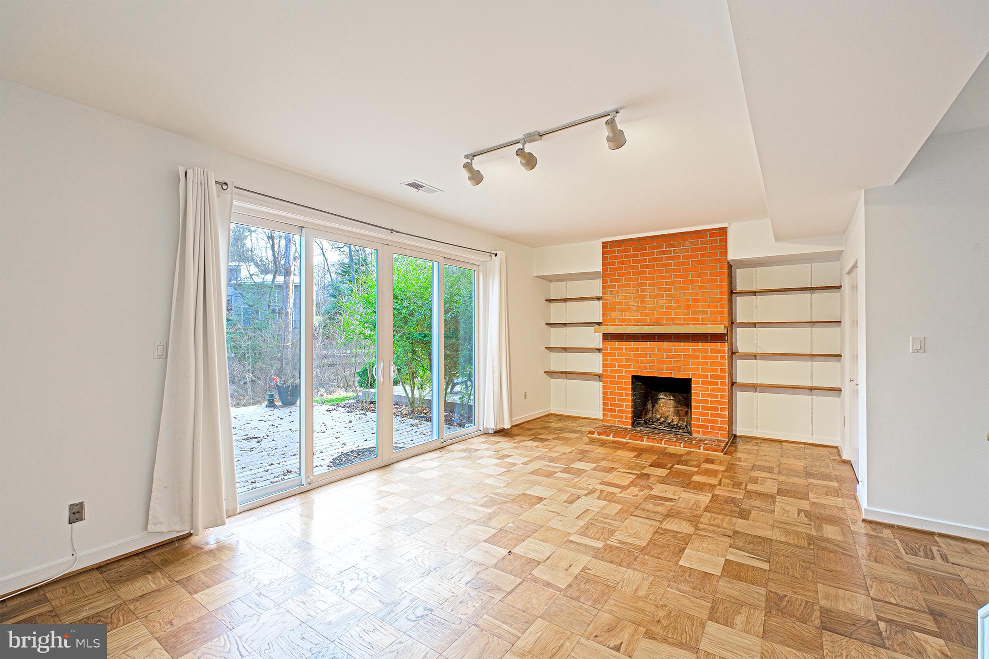 11495 Waterview Cluster Reston, VA 20190 - Photo 30 of 38 a view of a livingroom with a fireplace and a window