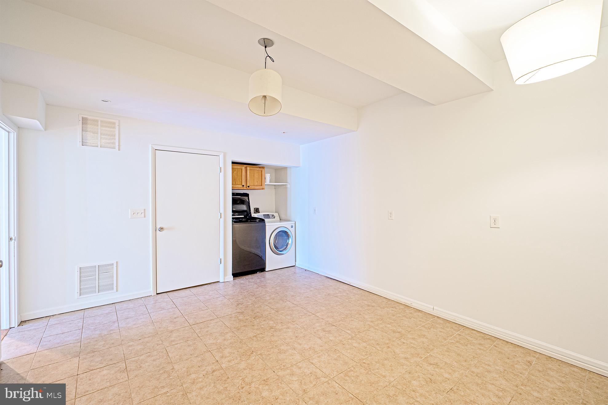 11495 Waterview Cluster Reston, VA 20190 - Photo 36 of 38 a view of empty room with cabinet and window
