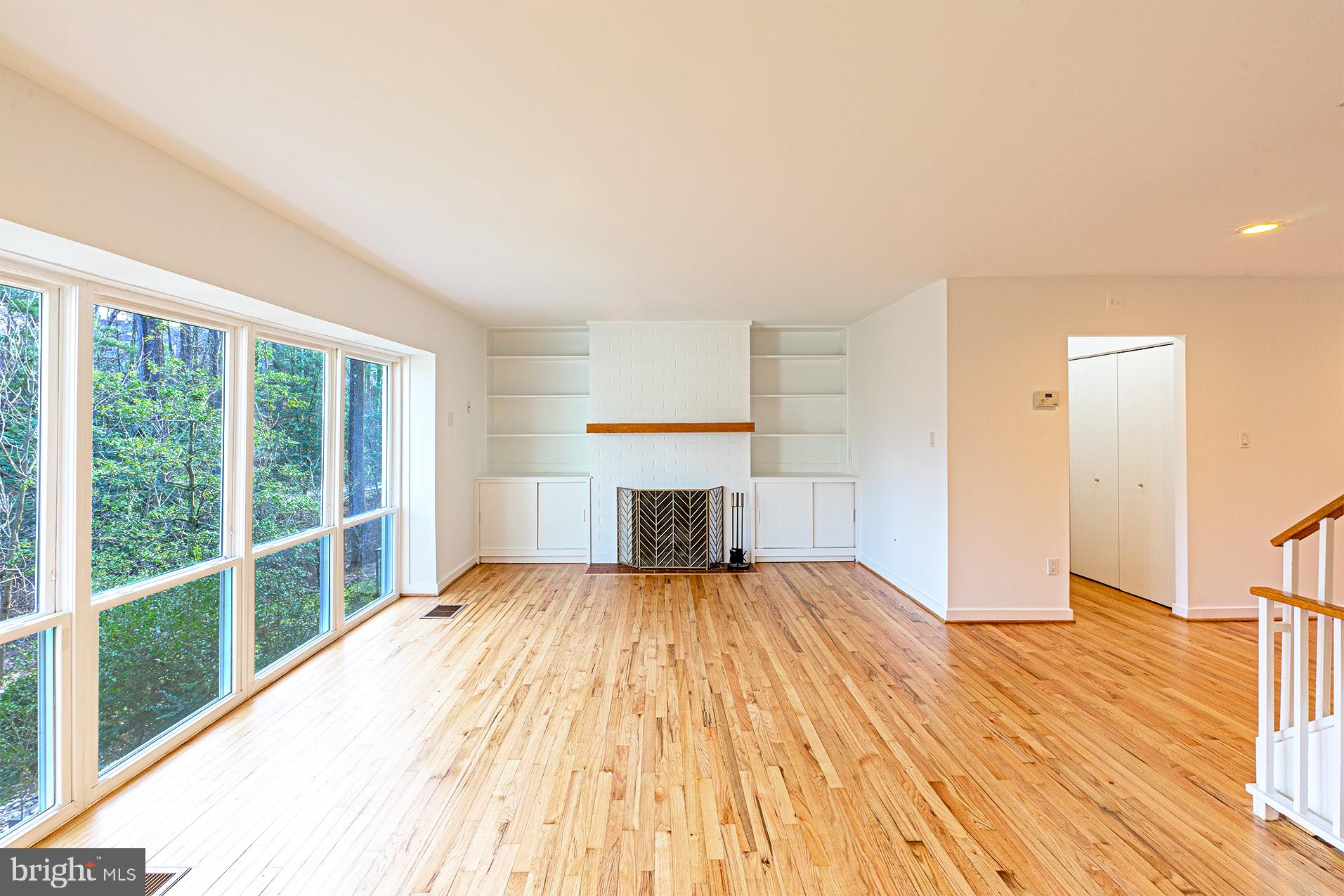 11495 Waterview Cluster Reston, VA 20190 - Photo 6 of 38 a view of a bedroom with wooden floor and balcony