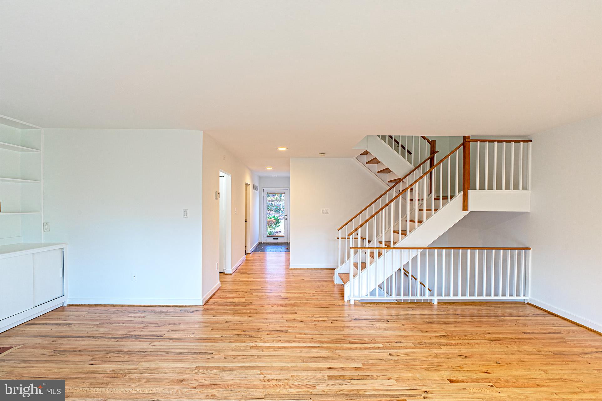11495 Waterview Cluster Reston, VA 20190 - Photo 8 of 38 a view of entryway and hall with wooden floor