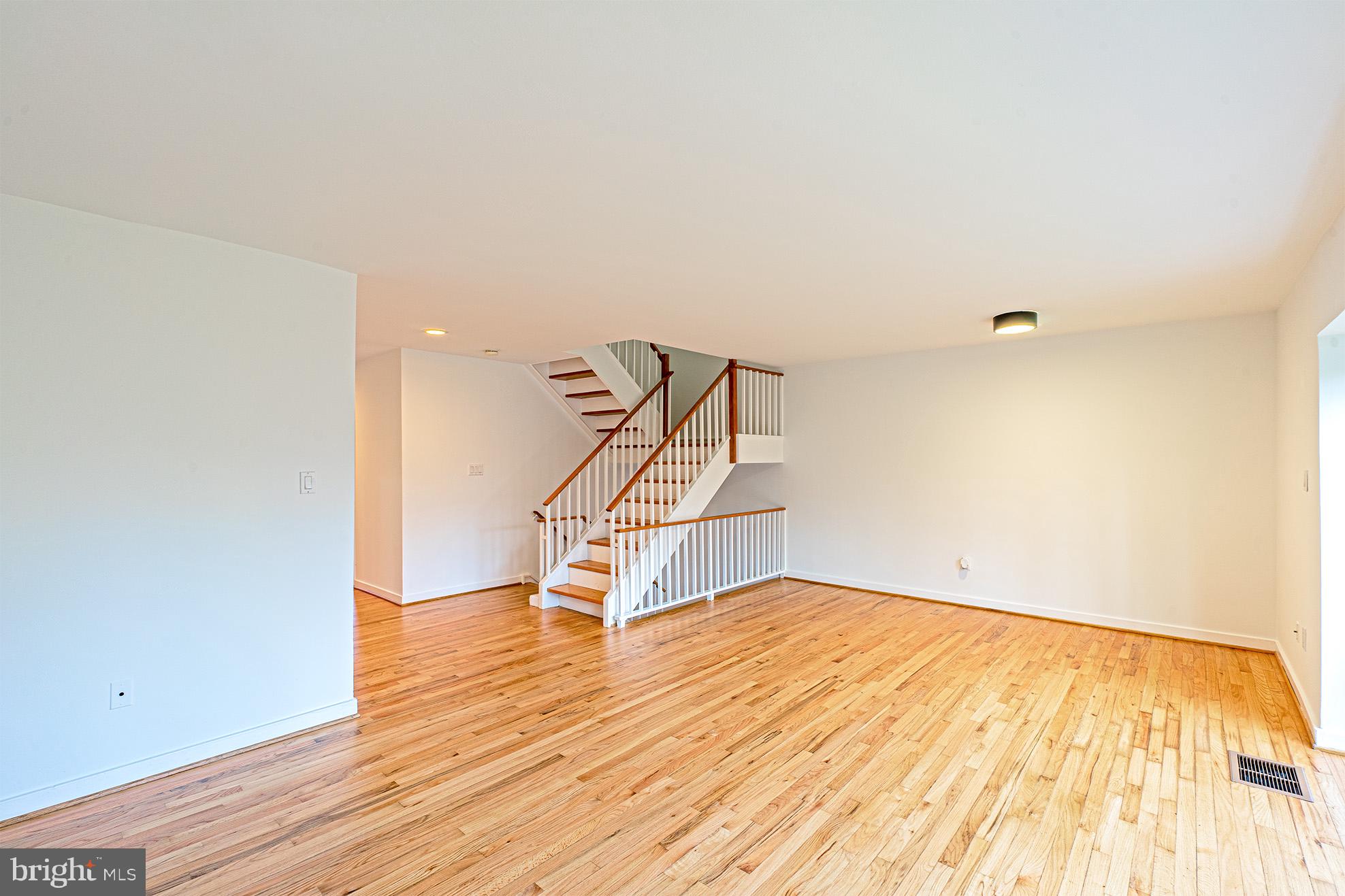 11495 Waterview Cluster Reston, VA 20190 - Photo 9 of 38 a view of an empty room with wooden floor