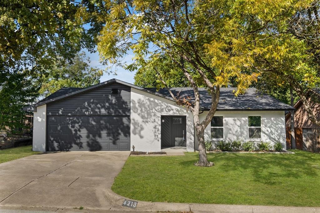 4213 Huckleberry Drive Fort Worth, TX 76137 - Photo 1 of 39 a front view of house with yard
