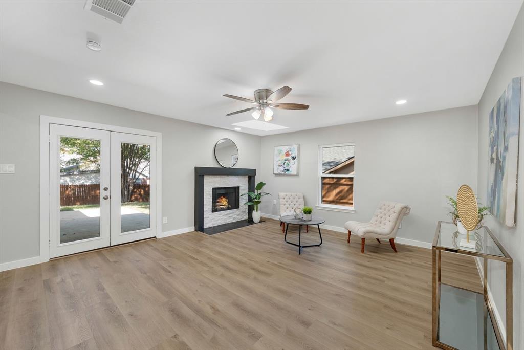 4213 Huckleberry Drive Fort Worth, TX 76137 - Photo 12 of 39 a living room with furniture and a fireplace