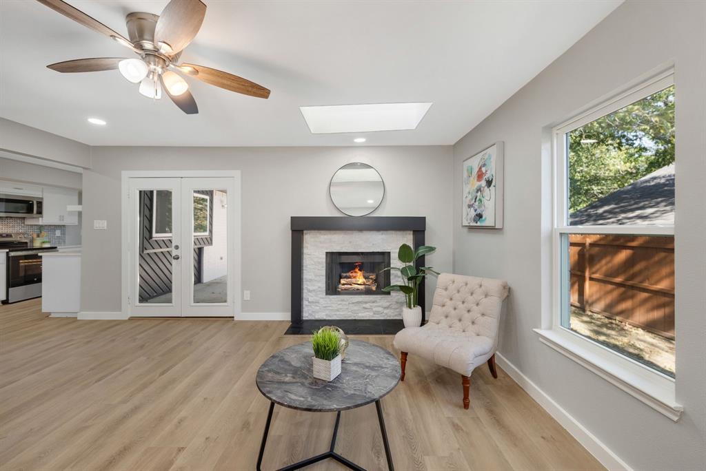 4213 Huckleberry Drive Fort Worth, TX 76137 - Photo 13 of 39 a living room with furniture and a fireplace