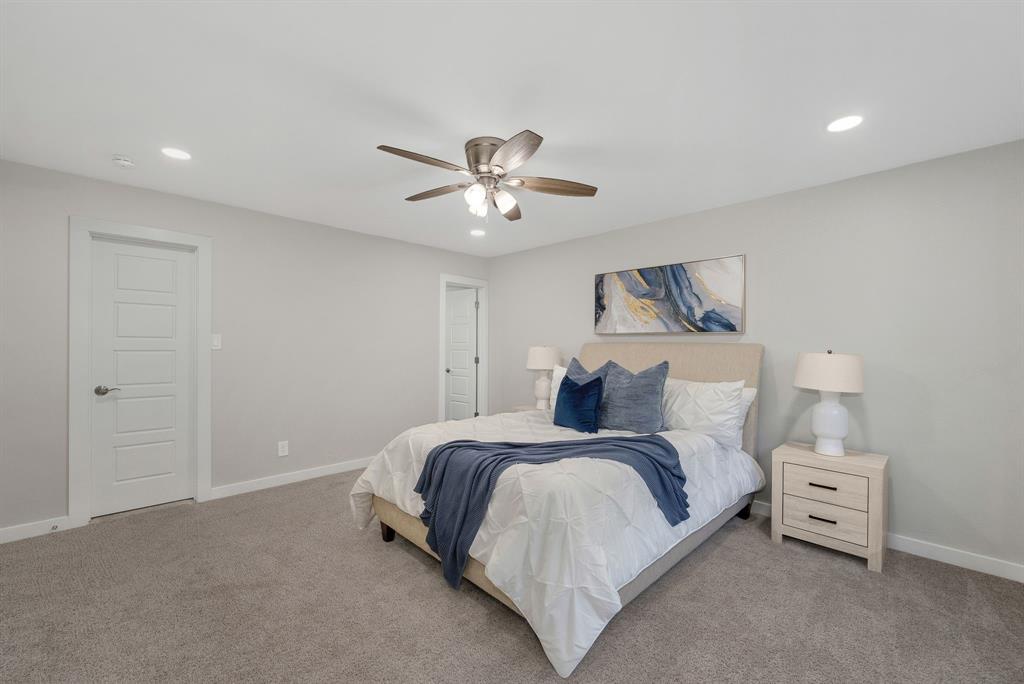 4213 Huckleberry Drive Fort Worth, TX 76137 - Photo 20 of 39 a bedroom with bed and a chandelier
