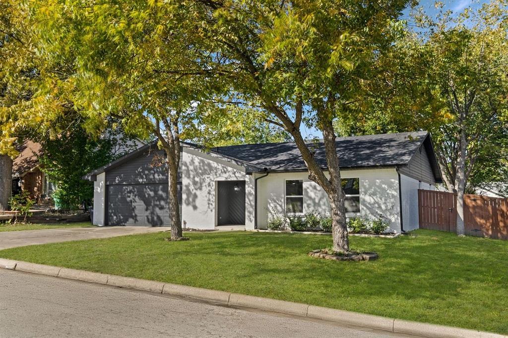 4213 Huckleberry Drive Fort Worth, TX 76137 - Photo 2 of 39 a front view of house with yard and green space