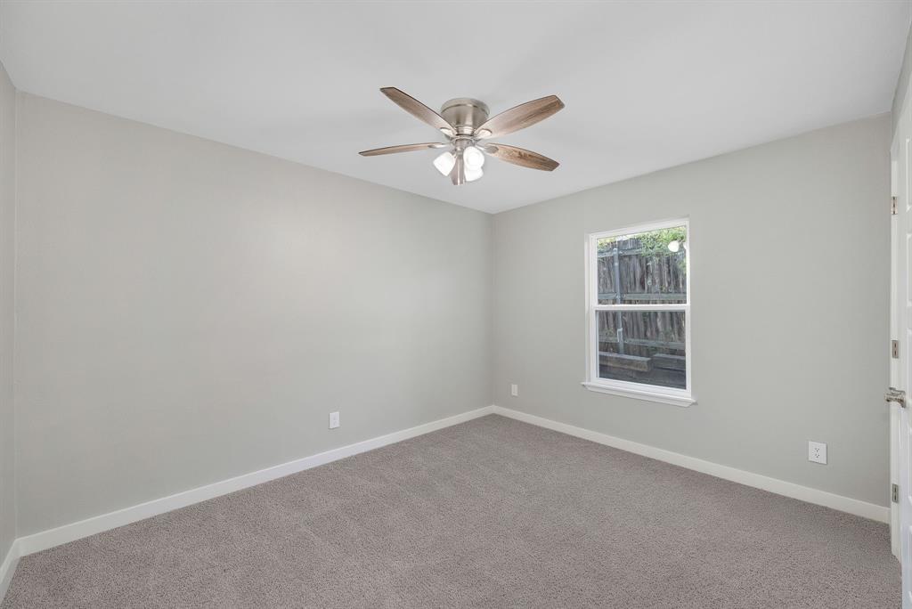 4213 Huckleberry Drive Fort Worth, TX 76137 - Photo 23 of 39 an empty room with window and ceiling fan