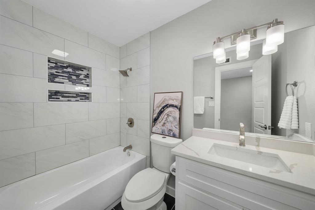 4213 Huckleberry Drive Fort Worth, TX 76137 - Photo 26 of 39 a bathroom with a sink a toilet and shower