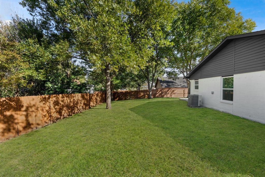 4213 Huckleberry Drive Fort Worth, TX 76137 - Photo 35 of 39 a view of a backyard with large trees