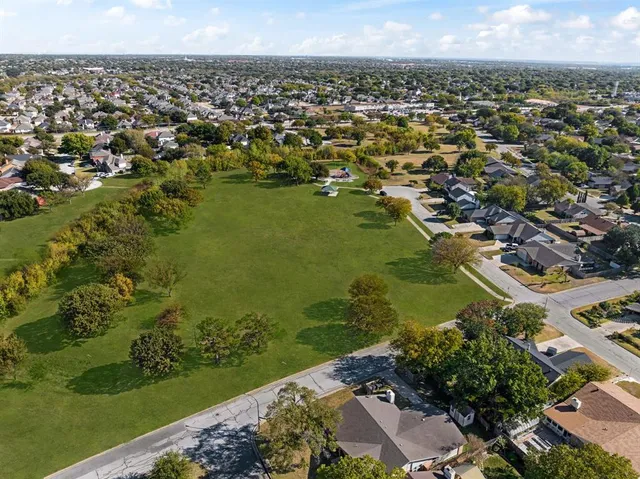 an aerial view of a houses with a lake view