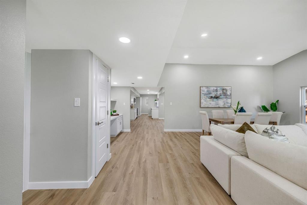 4213 Huckleberry Drive Fort Worth, TX 76137 - Photo 5 of 39 a living room with furniture and a wooden floor