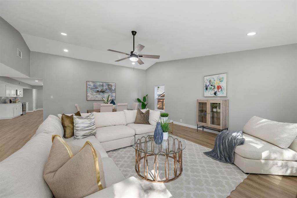 4213 Huckleberry Drive Fort Worth, TX 76137 - Photo 7 of 39 a living room with furniture and a chandelier