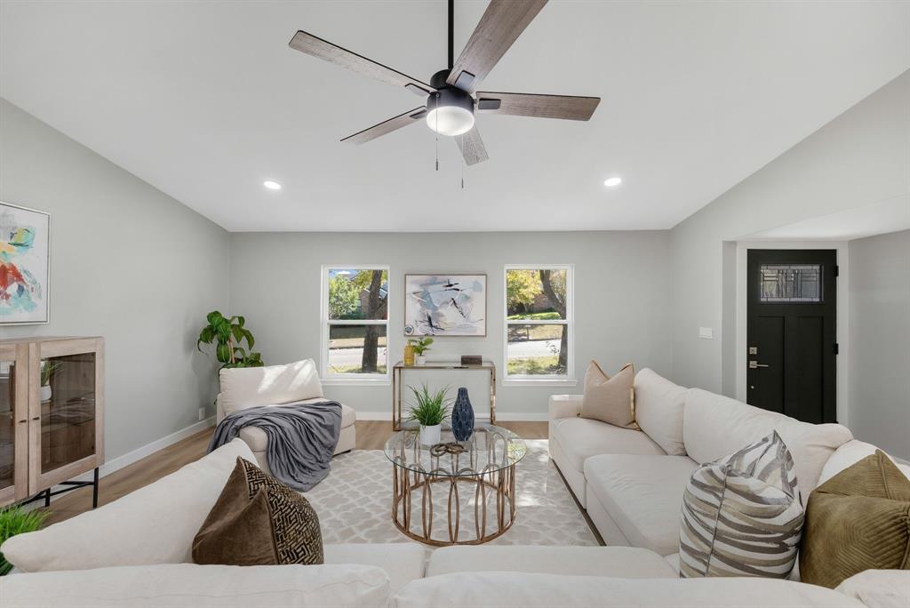 4213 Huckleberry Drive Fort Worth, TX 76137 - Photo 9 of 39 a living room with furniture and a large window