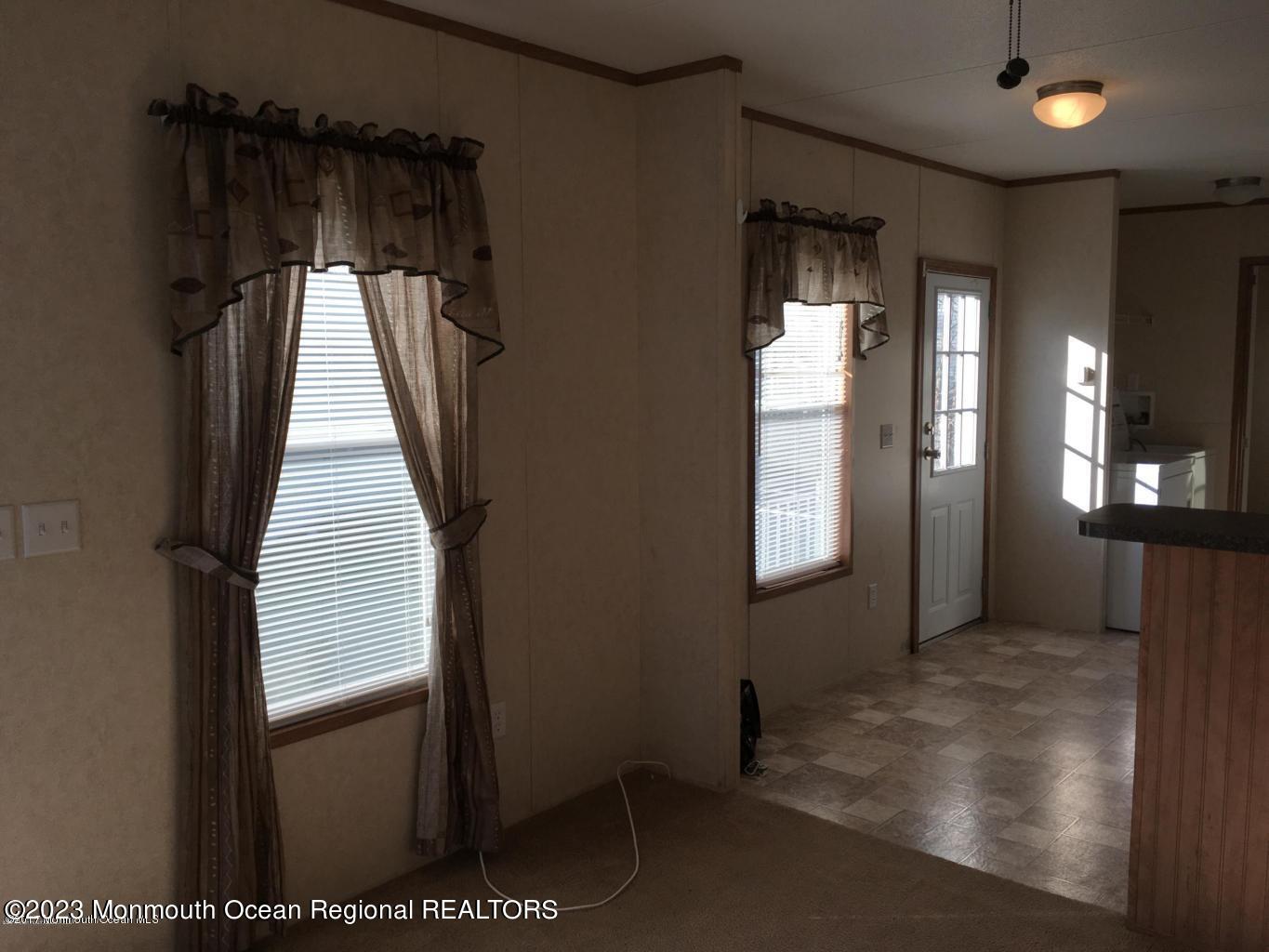 20 Monique Circle Hazlet, NJ 07730 - Photo 3 of 3 a view of a hallway with wooden floor and stairs