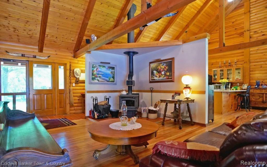6255 North Owosso Road Fowlerville, MI 48836 - Photo 15 of 31 Wood Stove on Main Floor. Great Room is large and open for variety of seating options