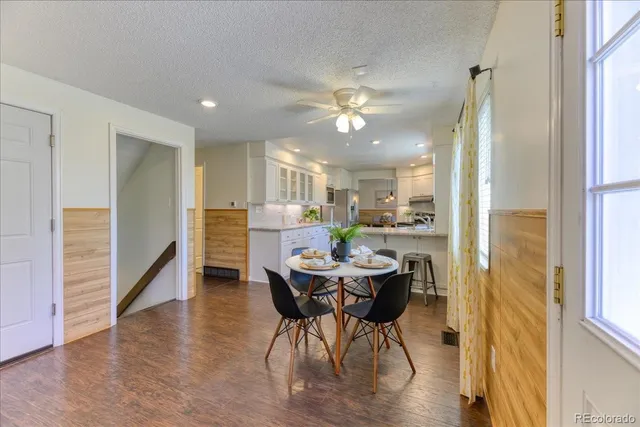 a view of a dining room with furniture window and wooden floor
