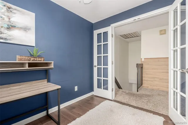 a view of a hallway with entryway and windows