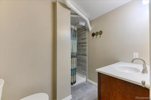 a bathroom with a sink and mirror