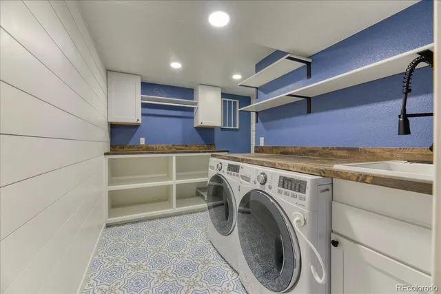 a view of storage and utility room with washer and dryer