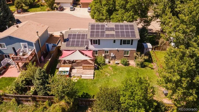 an aerial view of a house with a garden