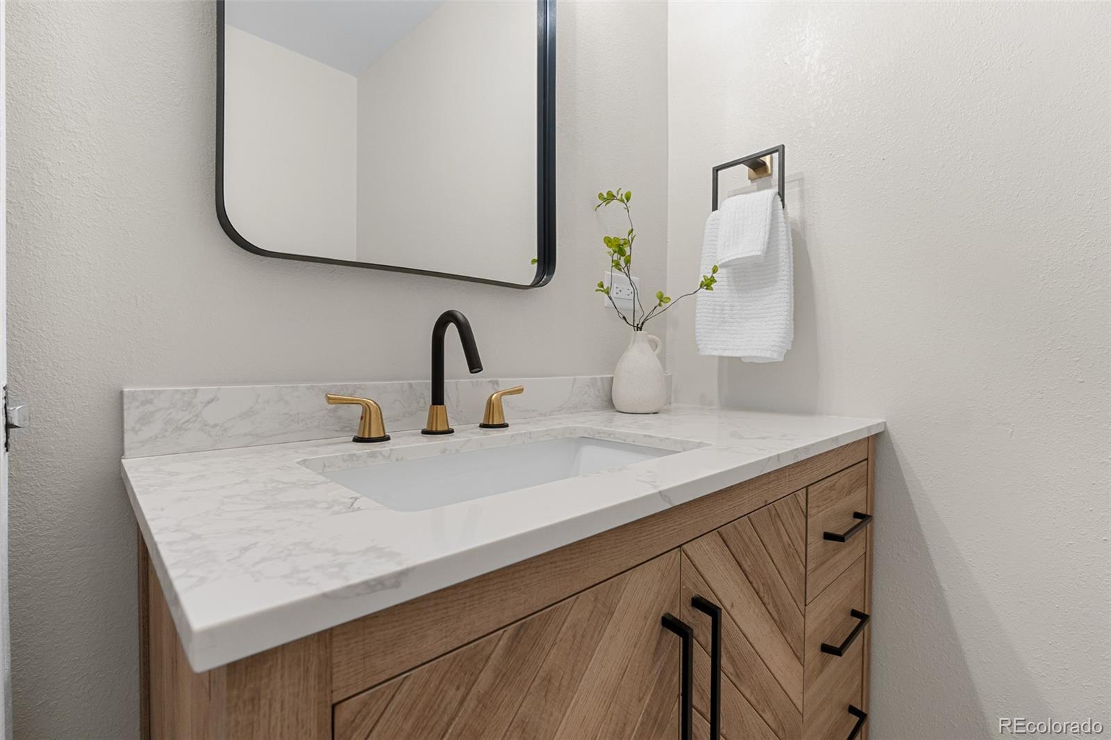 367 North Clarkson Street Denver, CO 80218 - Photo 24 of 50 a bathroom with a sink and a mirror
