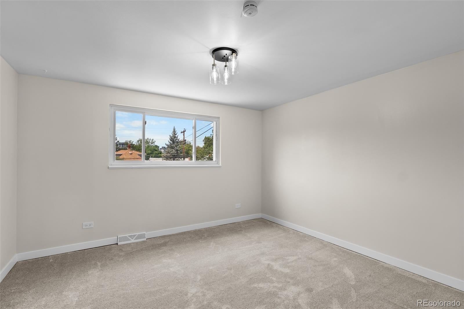 367 North Clarkson Street Denver, CO 80218 - Photo 28 of 50 an empty room with a window