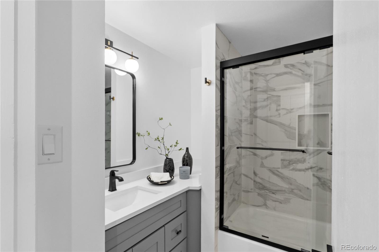 367 North Clarkson Street Denver, CO 80218 - Photo 33 of 50 a bathroom with a granite countertop shower sink and mirror