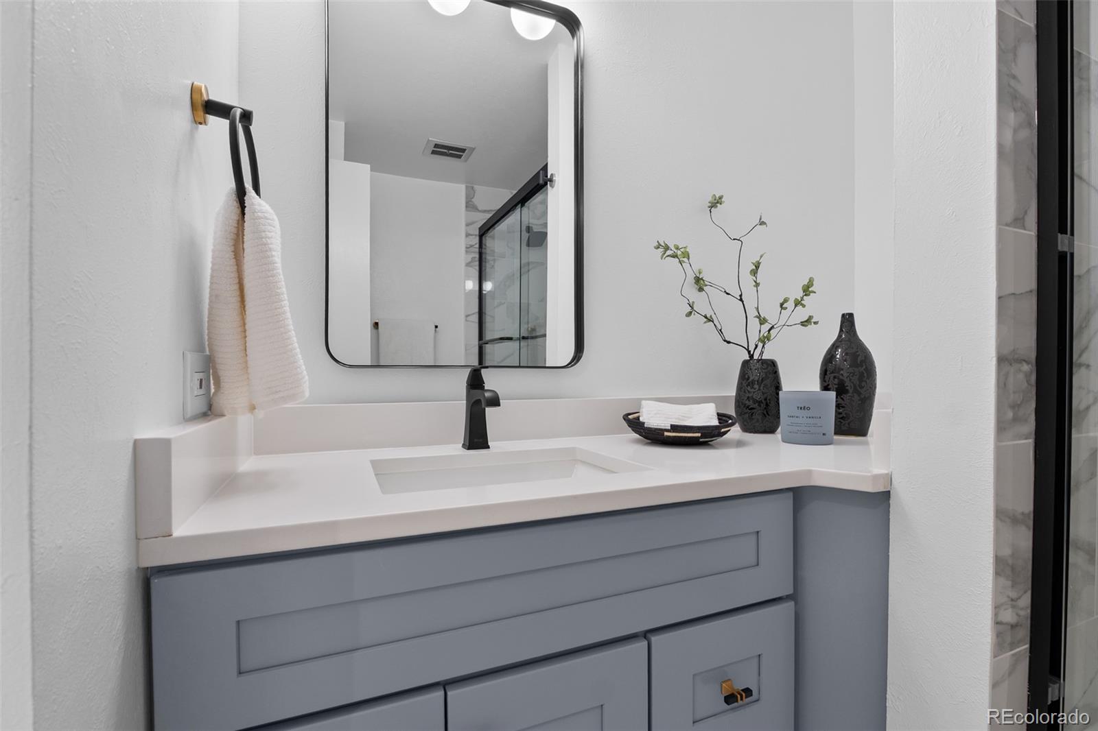 367 North Clarkson Street Denver, CO 80218 - Photo 34 of 50 a bathroom with a sink and vanity