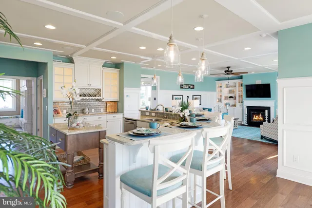 a living room with fireplace furniture and a flat screen tv