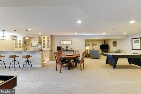 a very nice looking dining room with furniture and a chandelier